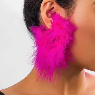 Side profile view of a person wearing a bright pink Confetti Feather Hoop earring.