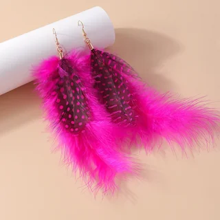 A pair of vivid pink plume drop earrings with darker spotted feather accents and a wispy outer fringe.