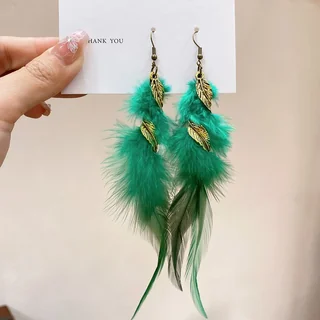 A pair of vibrant green feather earrings accented with small gold-toned leaf charms.