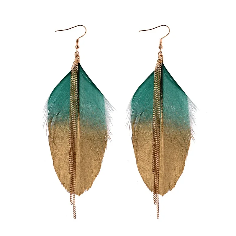 A pair of earrings consisting of a large, single feather shape overlaid with a thin, dangling metal chain.