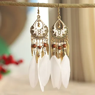 Close-up of Luna Feather Drops showing teardrop frames, beads, metal leaves, and white plumes hanging from gold-toned hooks.