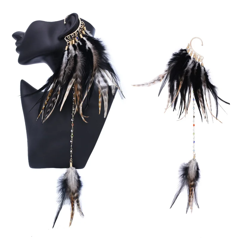 A dramatic ear cuff featuring a dense cluster of black and brown feathers with a long beaded chain hanging down.