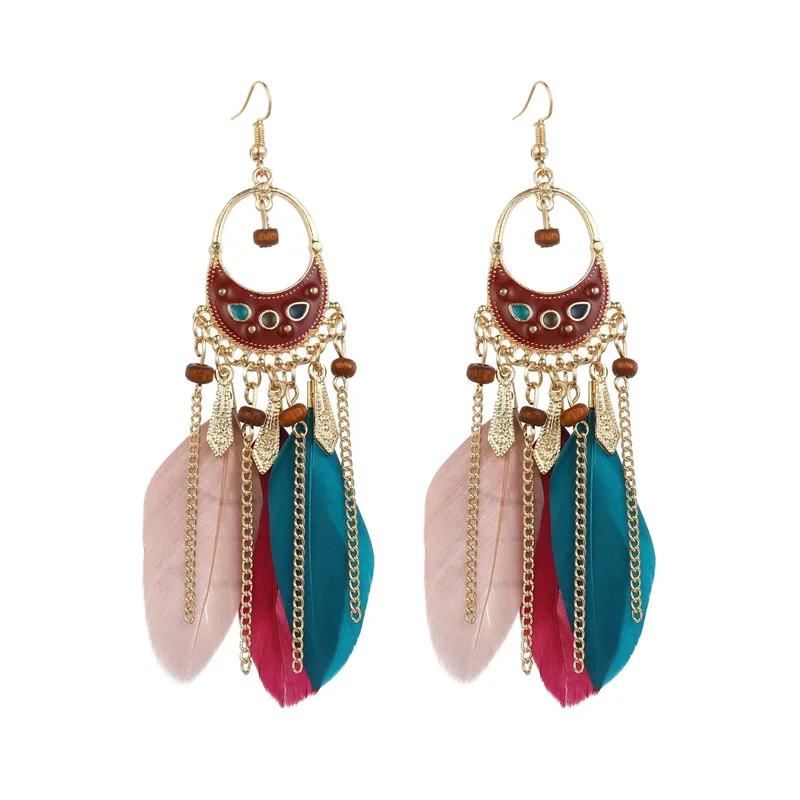 A pair of Palette Feather Drops featuring a metal crescent with enamel, beads, and dangling feathers.