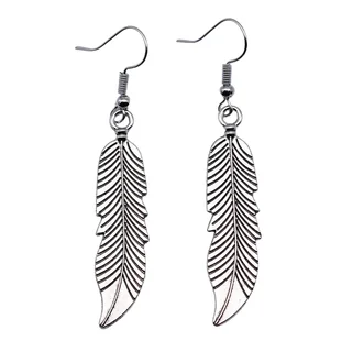 A pair of silver-toned metal feather earrings with cutout details hanging from hook wires.
