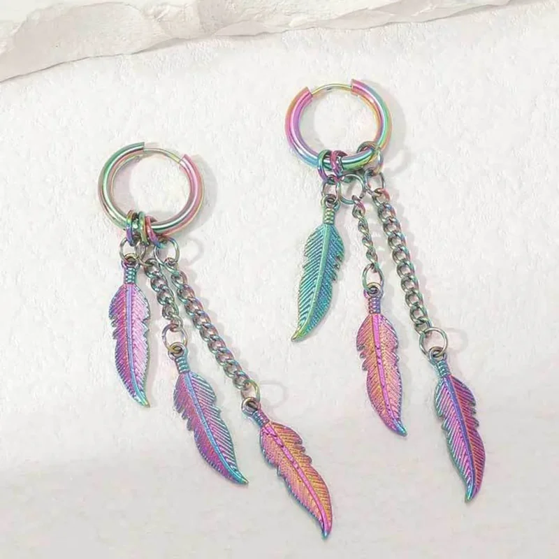 Hoop earrings with three dangling metal chains ending in etched metal feather-shaped charms.