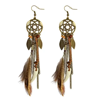 A pair of drop earrings with a circular star-patterned metal top, cascading chains, beads, and brown feathers on a white background.