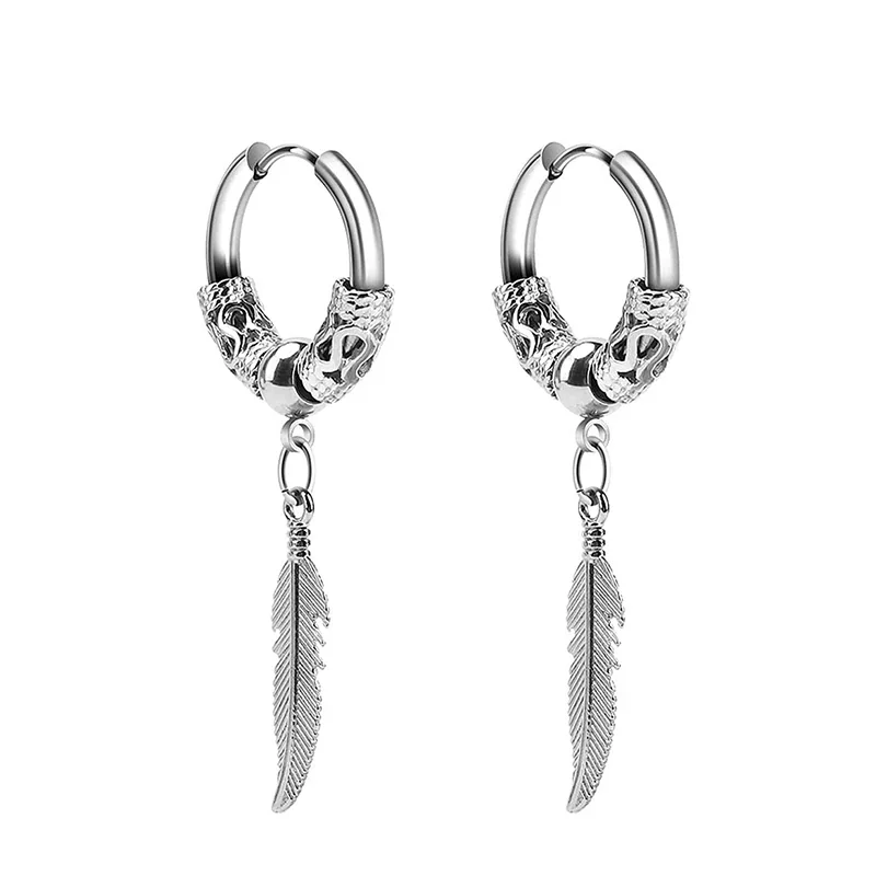 A pair of silver-toned hoop earrings with textured bands and hanging etched feather charms on a white background.