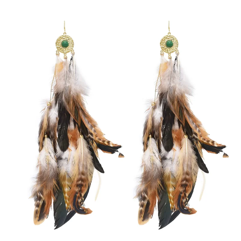 Long feather drop earrings with layered brown and patterned strands below rounded gold-toned upper ornaments with green accents.